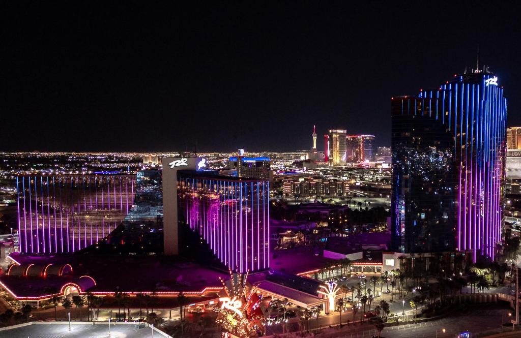 a view of a city at night with lit up buildings at Rio Hotel & Casino in Las Vegas