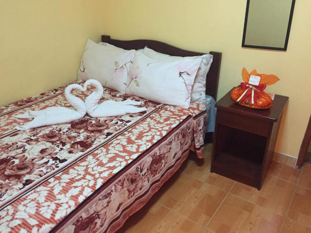 Voodi või voodid majutusasutuse TGH Guest House Badian toas