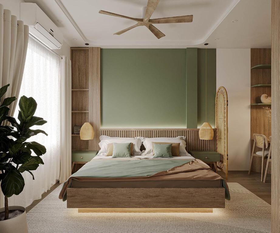 a bedroom with a bed and a ceiling fan at The Urban Westlake Apartment in Hanoi