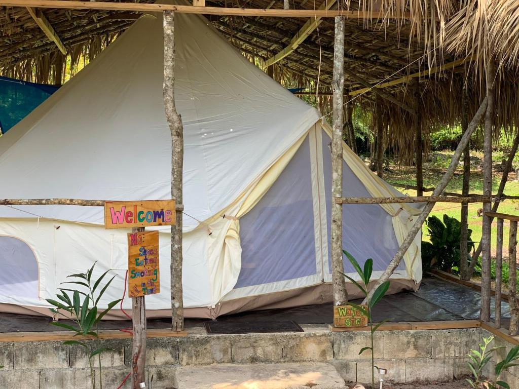 a large tent with a sign in front of it at Humble Boy retreat Glamping yurt in Negril