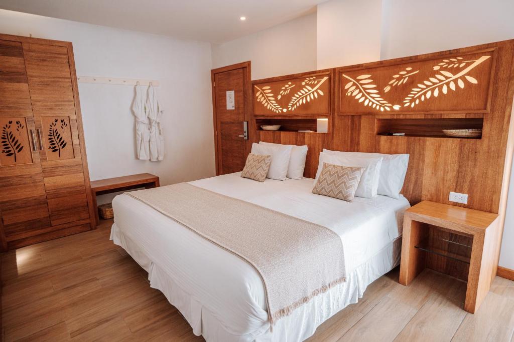 Postel nebo postele na pokoji v ubytování Hotel Acacia