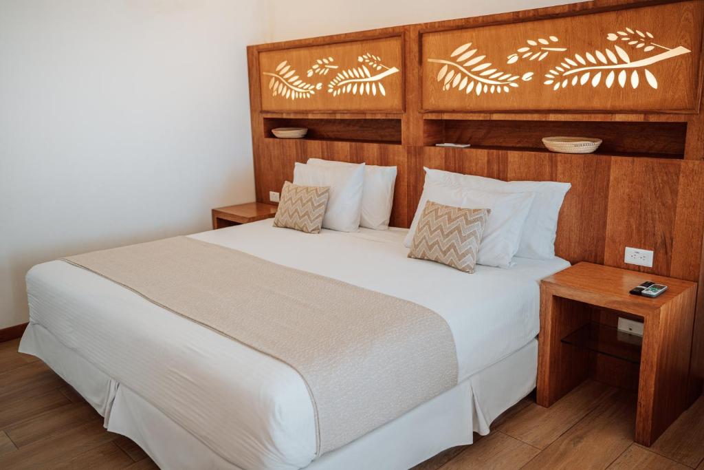 Postel nebo postele na pokoji v ubytování Hotel Acacia