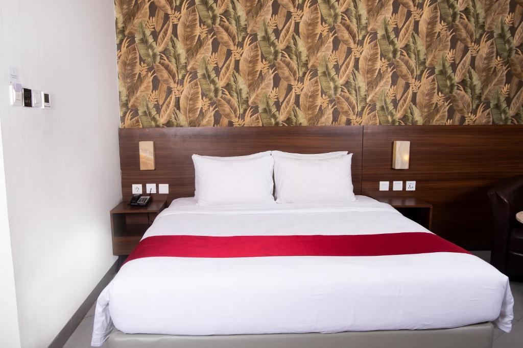Letto o letti in una camera di Pakons Prime Hotel