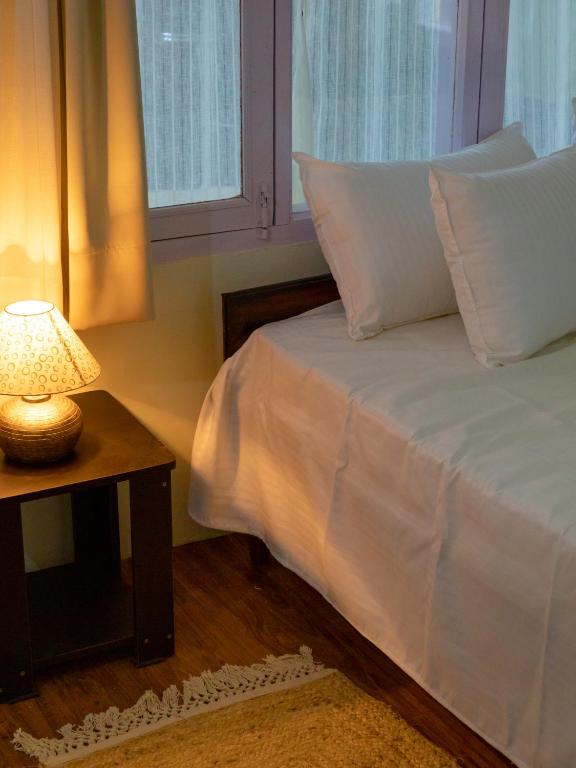 Postel nebo postele na pokoji v ubytování Mohija Homestay