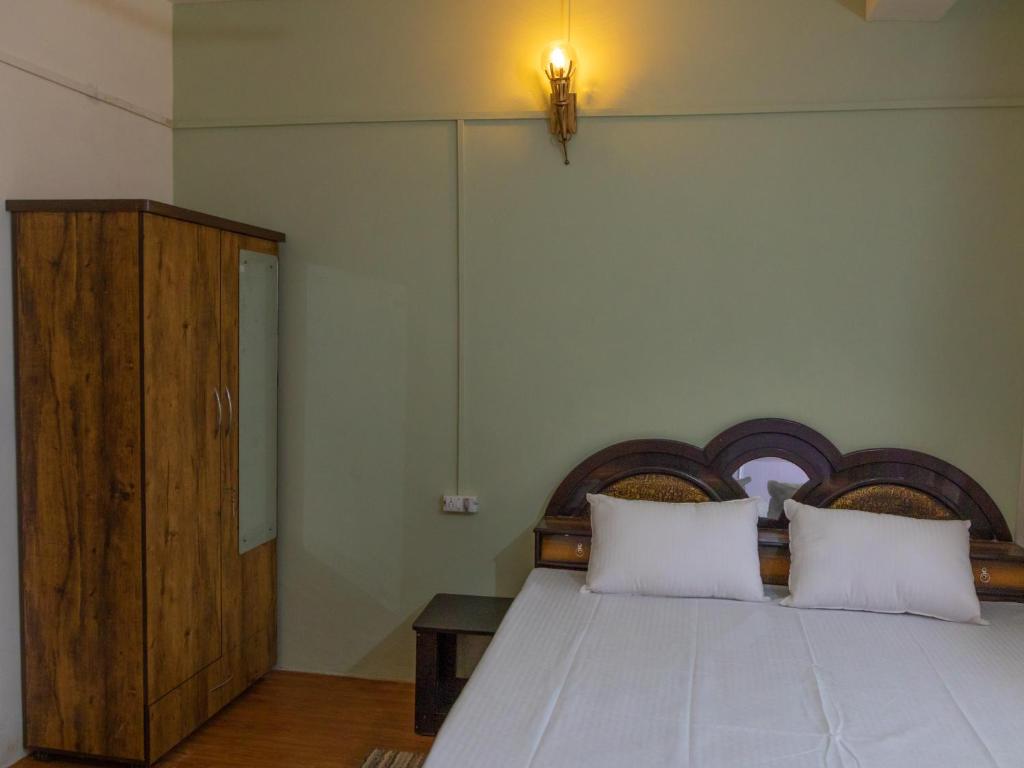 Postel nebo postele na pokoji v ubytování Mohija Homestay