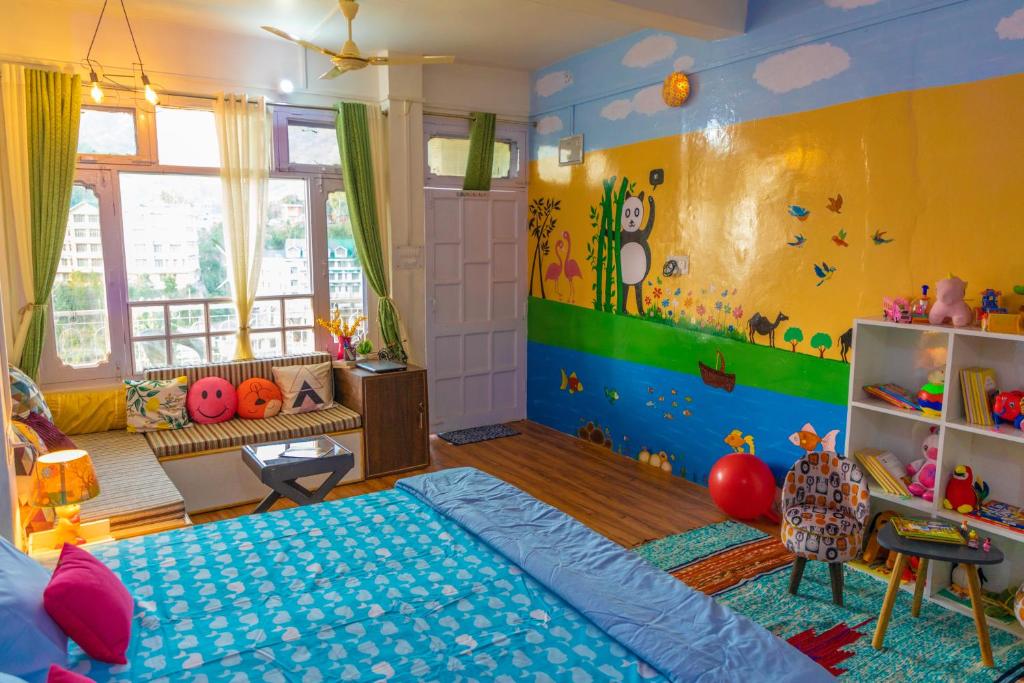 Postel nebo postele na pokoji v ubytování Mohija Homestay