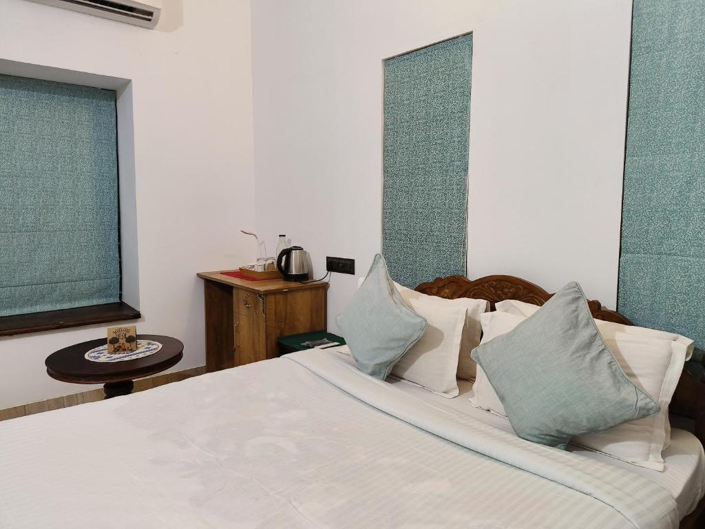 Postel nebo postele na pokoji v ubytování Ananda Holiday Home