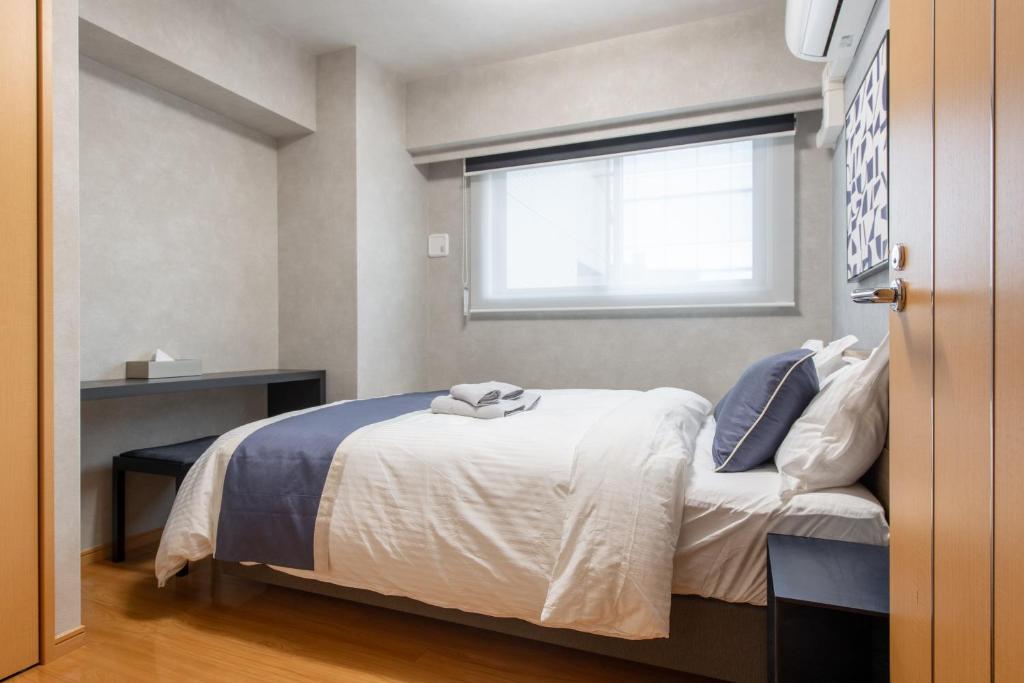 Postel nebo postele na pokoji v ubytování ACROSS Akihabara