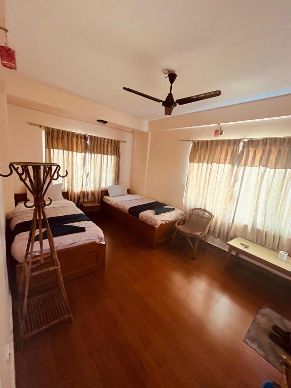 Llit o llits en una habitació de Hotel Global Inn