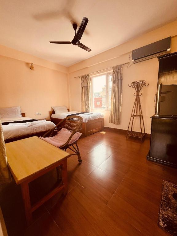 Llit o llits en una habitació de Hotel Global Inn