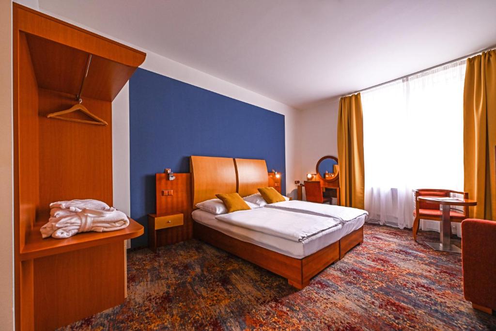 Postel nebo postele na pokoji v ubytování Hotel Atlantis
