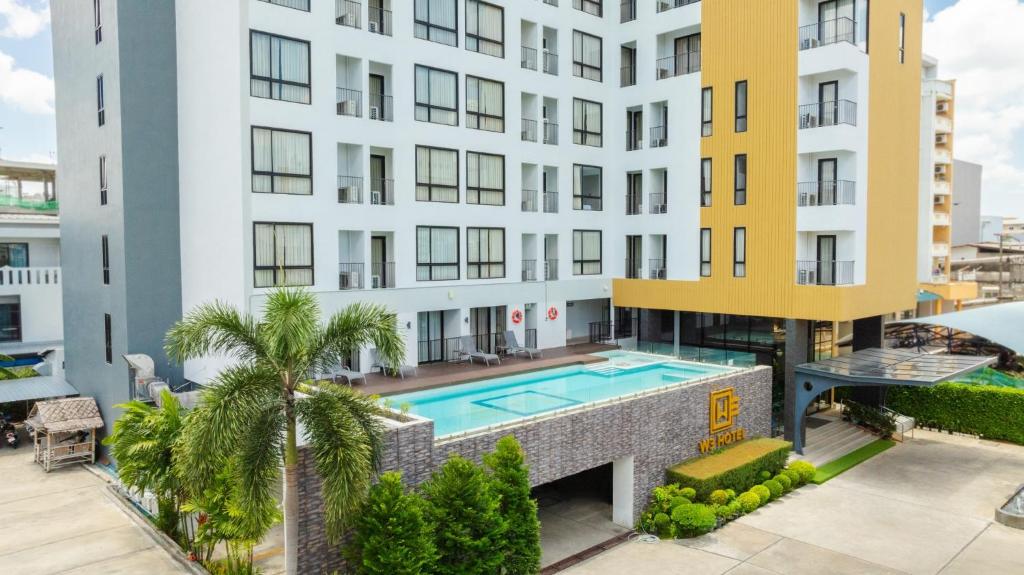 an aerial view of a building with a swimming pool at W3 Hotel in Hat Yai