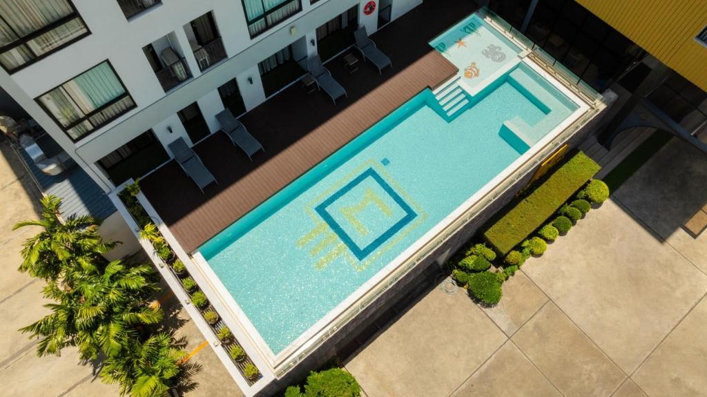 an overhead view of a swimming pool in a building at W3 Hotel in Hat Yai