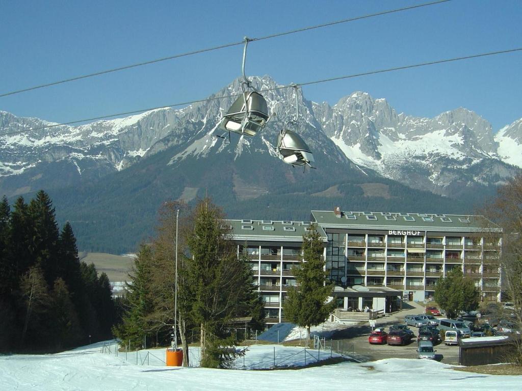 a ski lift in front of a hotel with a mountain at Apartment in Ellmau with Ski-In Access in Ellmau