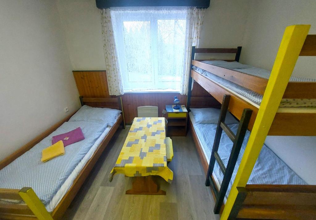 Postel nebo postele na pokoji v ubytování U Dvou rysů