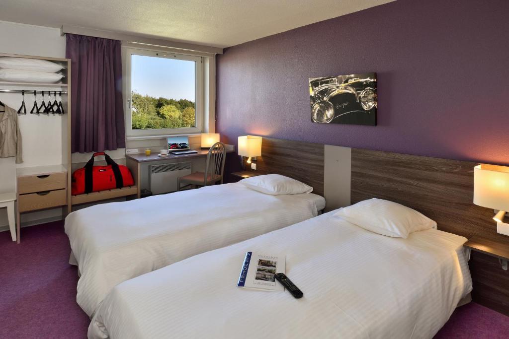 Postel nebo postele na pokoji v ubytování Als Hôtel