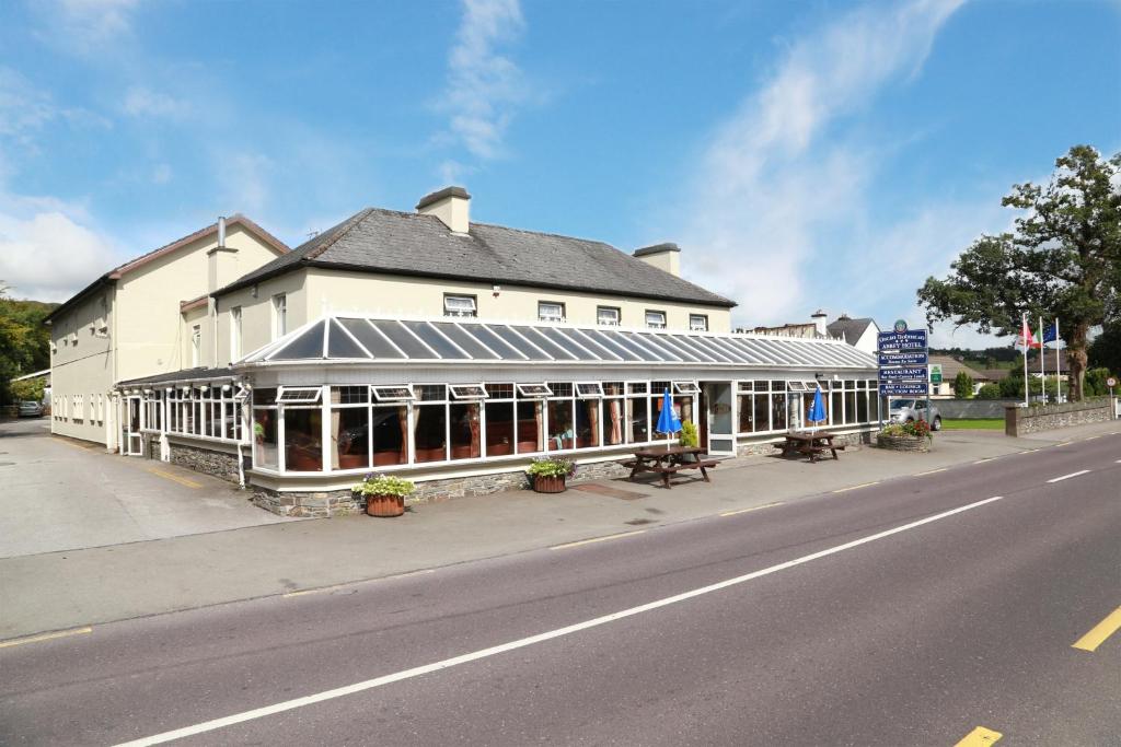 a building on the side of a street at Abbey Hotel in Ballyvourney