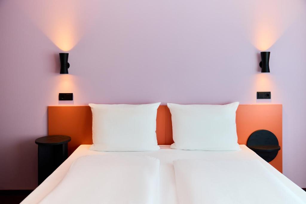 Postel nebo postele na pokoji v ubytování McDreams Hotel Leipzig