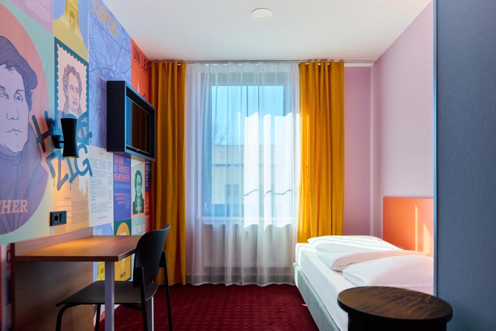 Postel nebo postele na pokoji v ubytování McDreams Hotel Leipzig