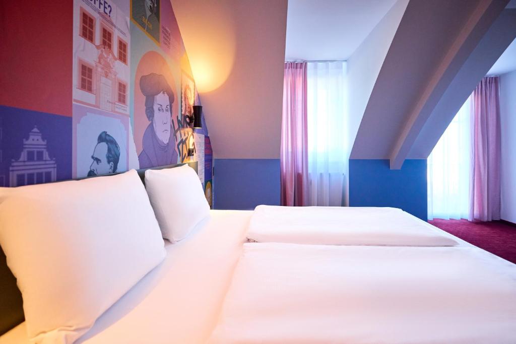 Postel nebo postele na pokoji v ubytování McDreams Hotel Leipzig