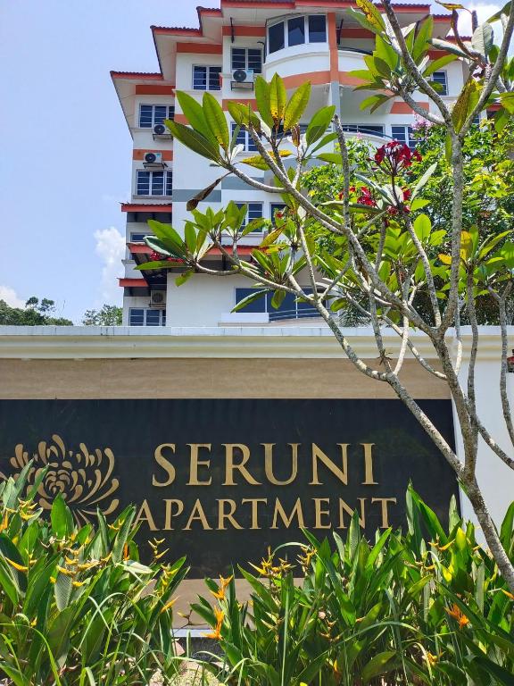 a sign in front of a building at 3 Bedrooms 2 Bathrooms Seruni Apartment, Serendah Gold Resort, Persiaran Meranti Selatan, Ulu Selangor, 48200 in Serendah
