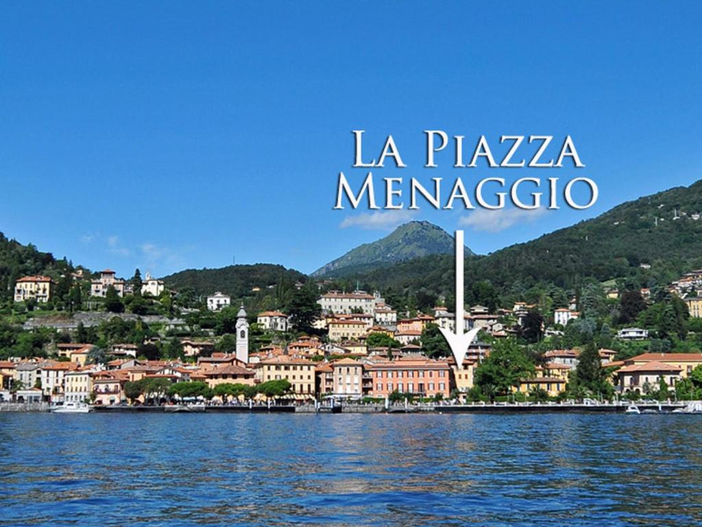 a view of la plaza meyerico from the water at La Piazza Menaggio in Menaggio