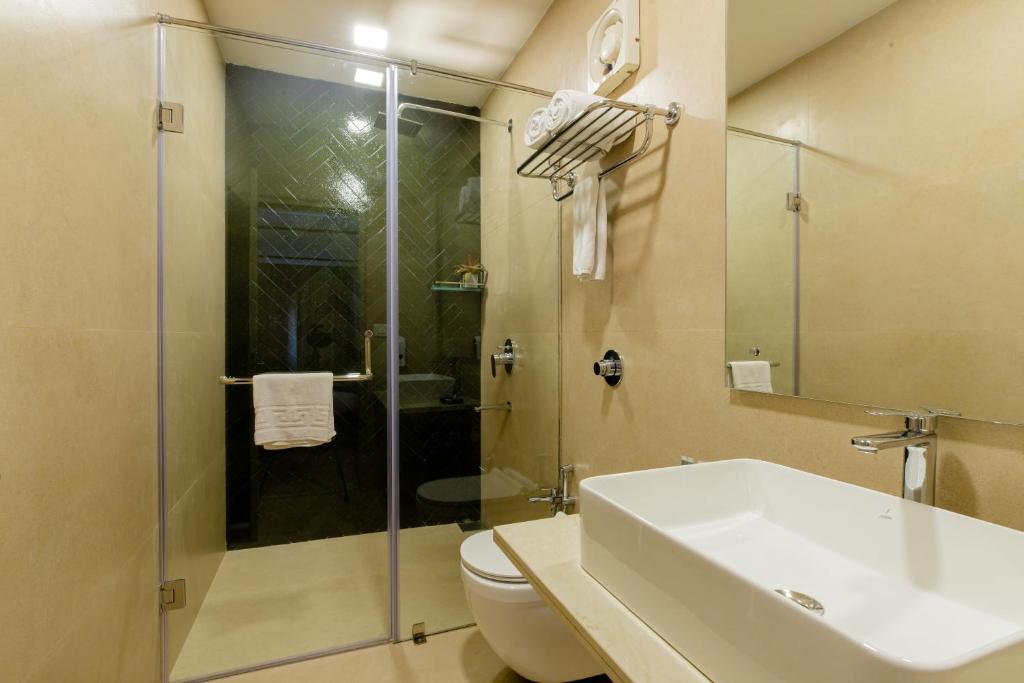 Ванная комната в Aguada Anchorage - The Villa Resort, Candolim