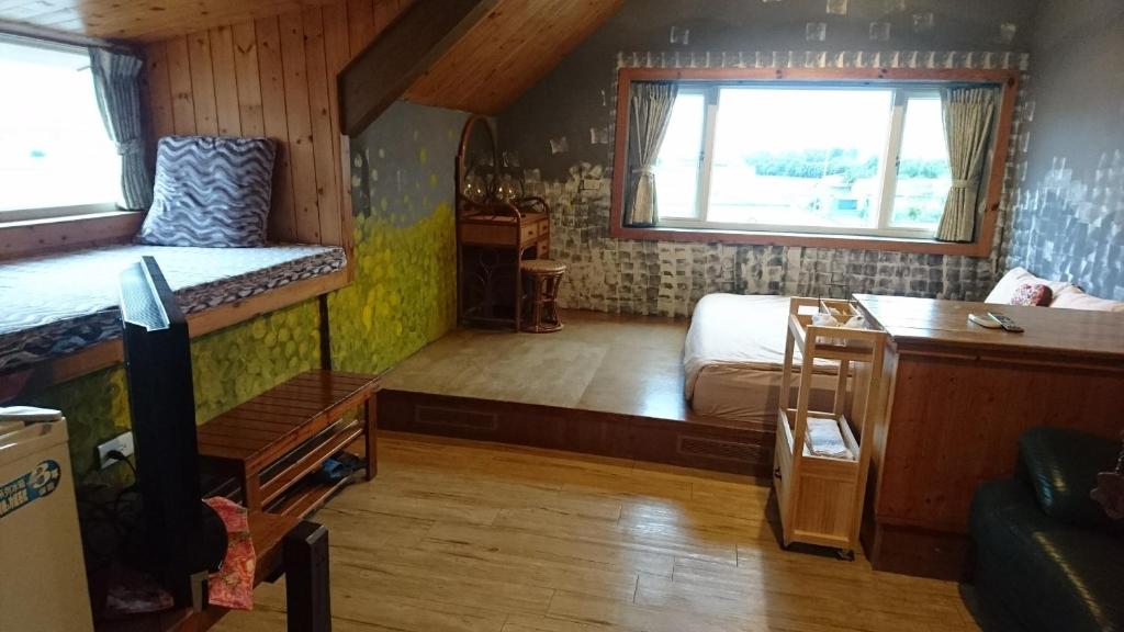 Postel nebo postele na pokoji v ubytování Xian Qing Yu Zhi Homestay