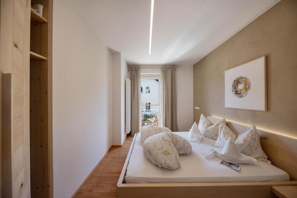 Ένα ή περισσότερα κρεβάτια σε δωμάτιο στο Alpimena Natur-Apartments Meran