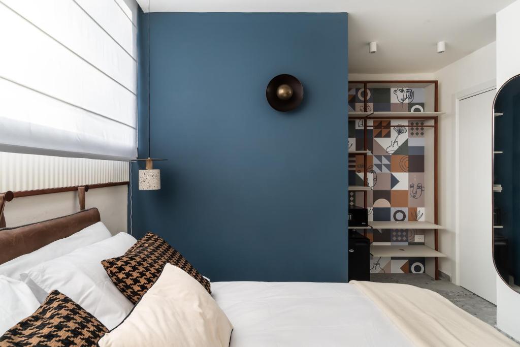 Postel nebo postele na pokoji v ubytování Mulan Hotel