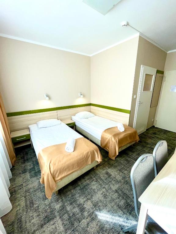 Postel nebo postele na pokoji v ubytování eMKa Hostel