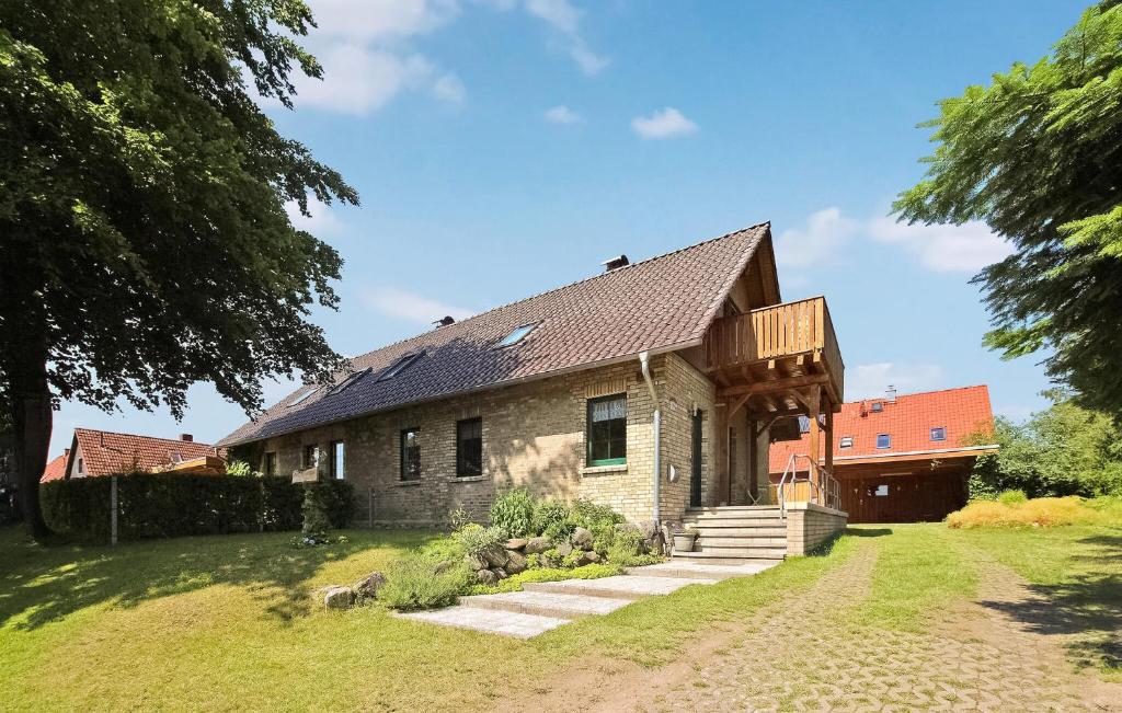 a stone house with a gambrel roof at Stunning Apartment In Jabel Ot Loppin With Kitchen in Loppin