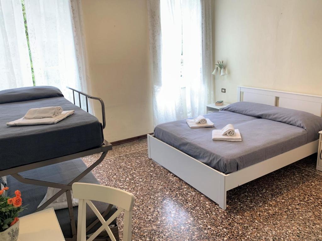 Łóżko lub łóżka w pokoju w obiekcie Hotel Baia di Levanto