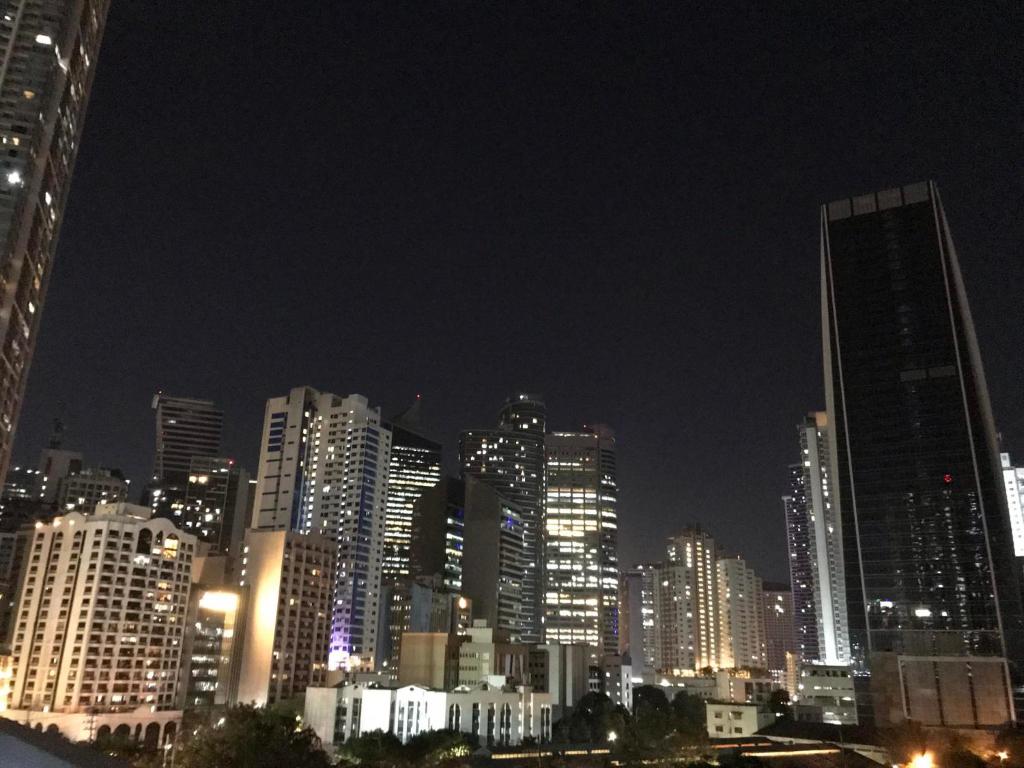 a city skyline at night with tall buildings at Condo with Patio at Makati SM Jazz offers Netflix in Manila