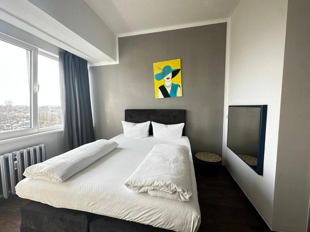 Postel nebo postele na pokoji v ubytování Ootel.com