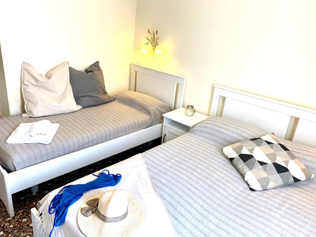 Łóżko lub łóżka w pokoju w obiekcie Hotel Baia di Levanto