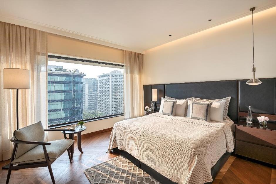 Postel nebo postele na pokoji v ubytování The Oberoi Mumbai