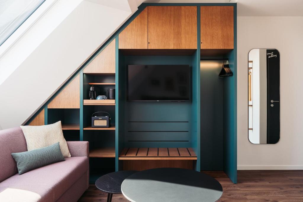 TV a/nebo společenská místnost v ubytování Hotel Schani UNO City