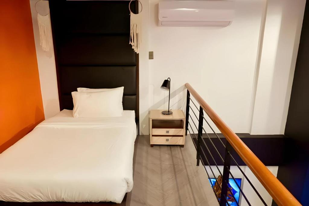 Postel nebo postele na pokoji v ubytování Havitat Boutique Hotel