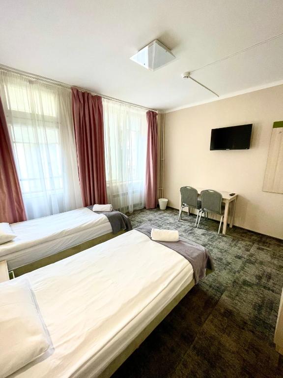 Postel nebo postele na pokoji v ubytování eMKa Hostel