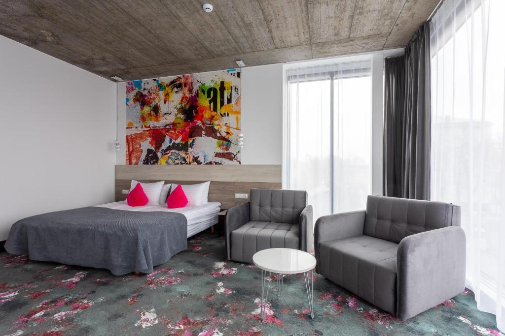 Postel nebo postele na pokoji v ubytování Algiro Hotel
