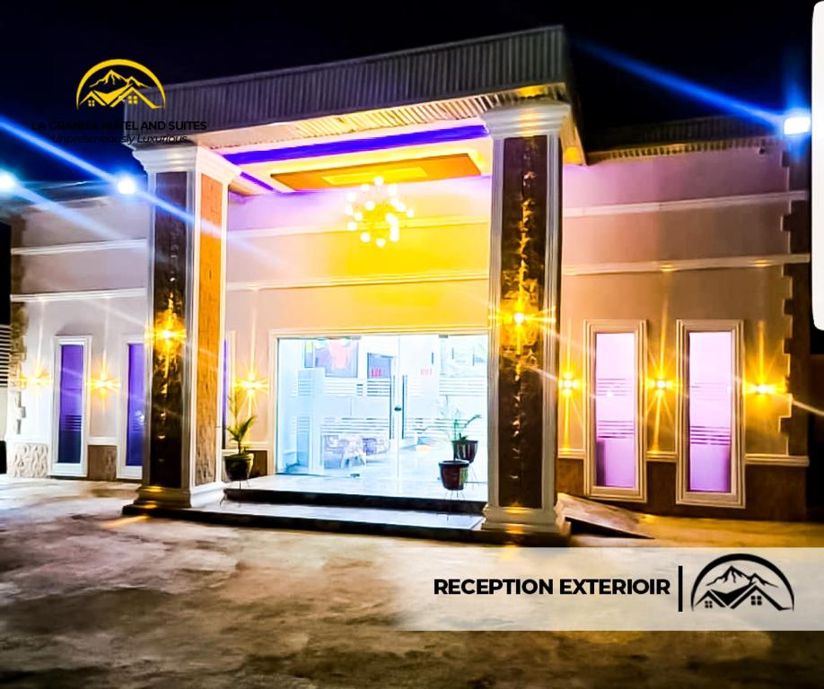 a store front at night with purple and purple lights at LA GRANITA HOTEL AND SUITES in Ado Ekiti