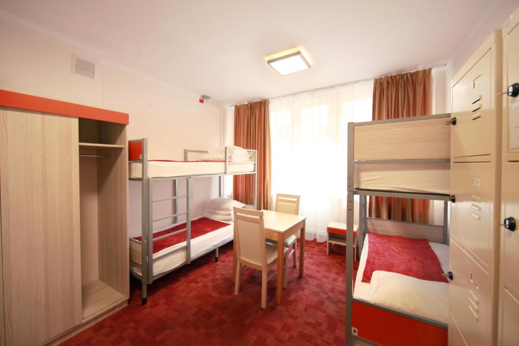 Postel nebo postele na pokoji v ubytování eMKa Hostel