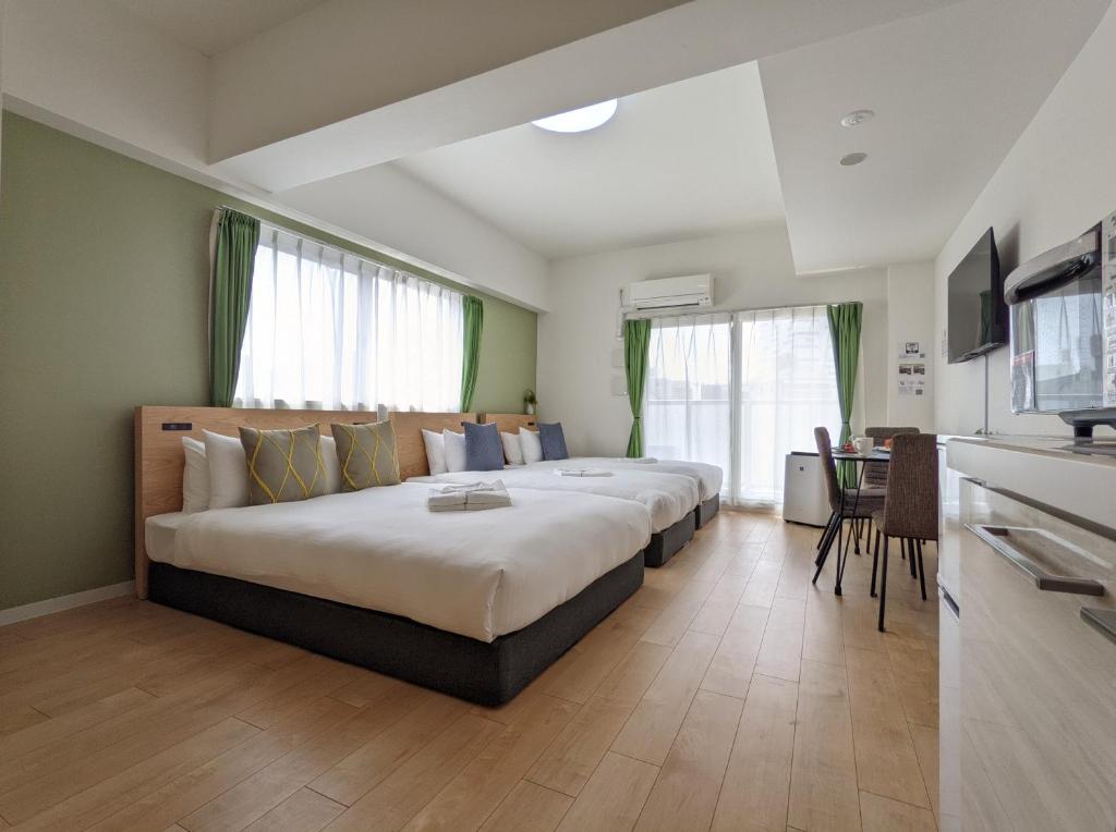 Postel nebo postele na pokoji v ubytování ESLEAD HOTEL Namba South Ⅰ