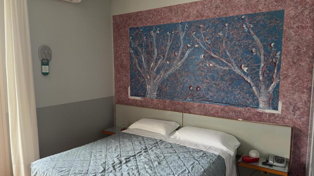 Postel nebo postele na pokoji v ubytování Hotel Luna