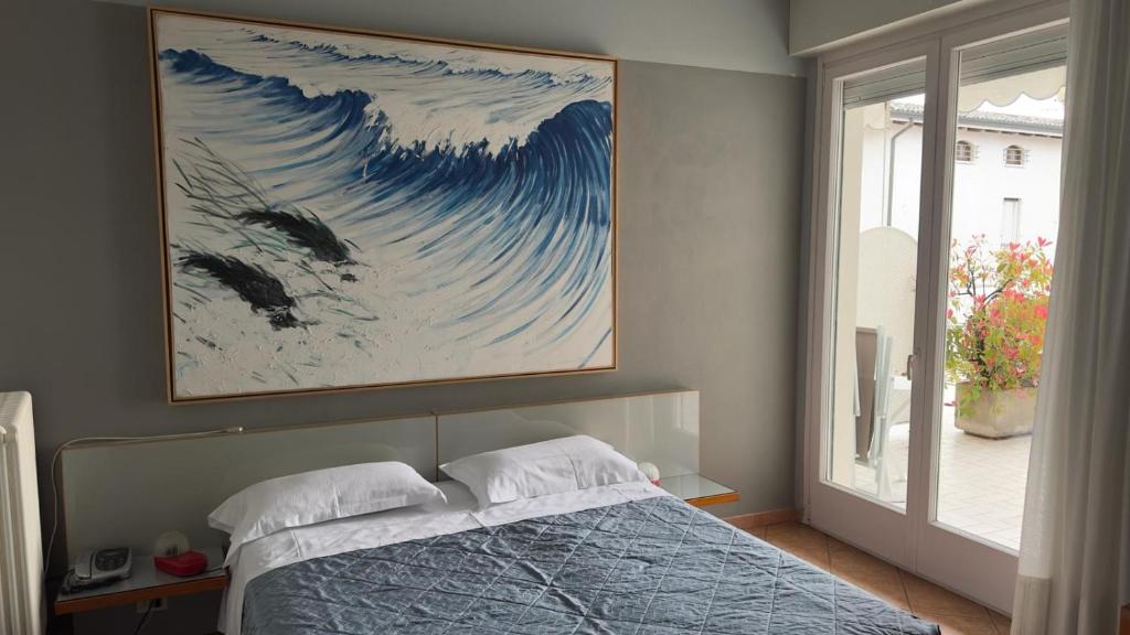 Postel nebo postele na pokoji v ubytování Hotel Luna
