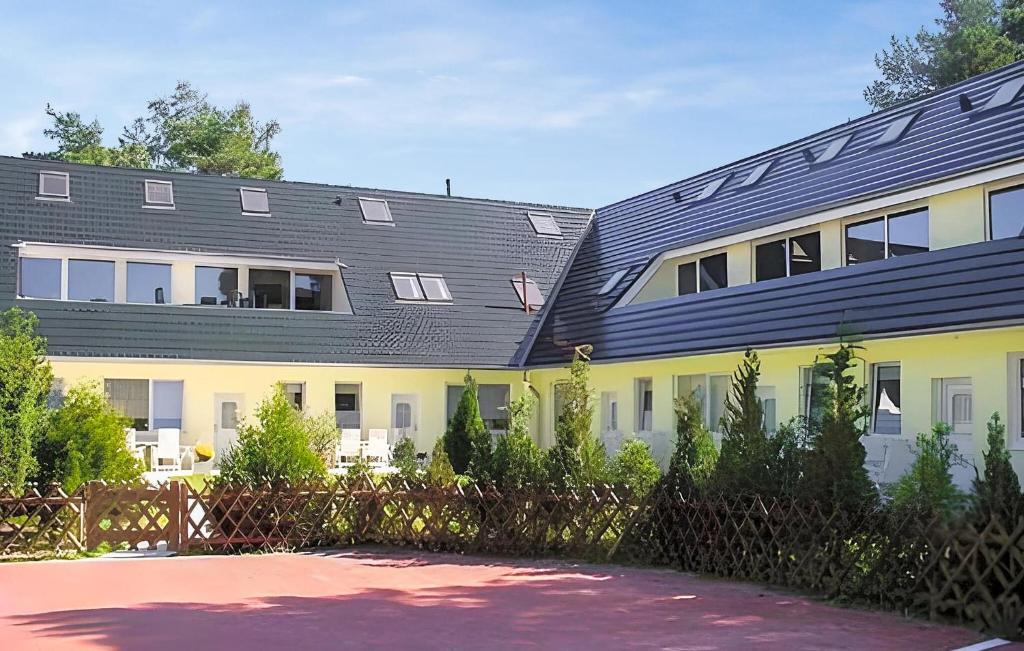 a building with solar panels on its roof at Beautiful Apartment In Ostseebad Breege Ot Ju With Kitchen in Drewoldke
