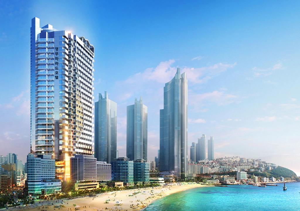 a view of a city with a beach and buildings at Haeundae Youngmu Parade Hotel in Busan
