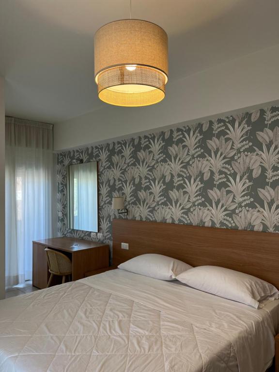 Postel nebo postele na pokoji v ubytování Hotel Majorca sul Mare in centro a Riccione