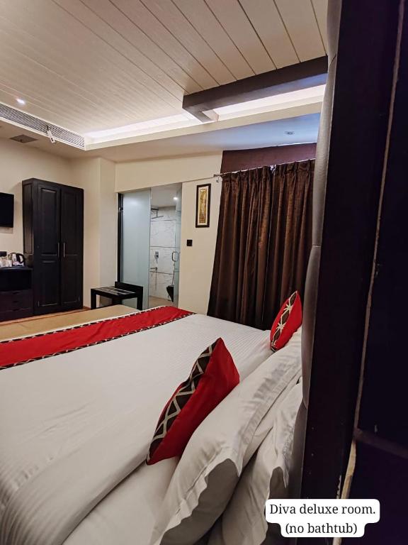 Postel nebo postele na pokoji v ubytování Divan Clarks Inn Goa